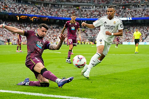 La liga 2024-25: Real Madrid's Kylian Mbappe, right, and Valladolid's Luis Perez challenge for the ball
